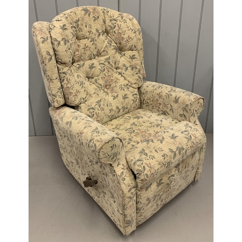 164B - A manual, reclining armchair, upholstered in cream/floral fabric.
Dimensions(cm) H104 (45 to seat), ... 