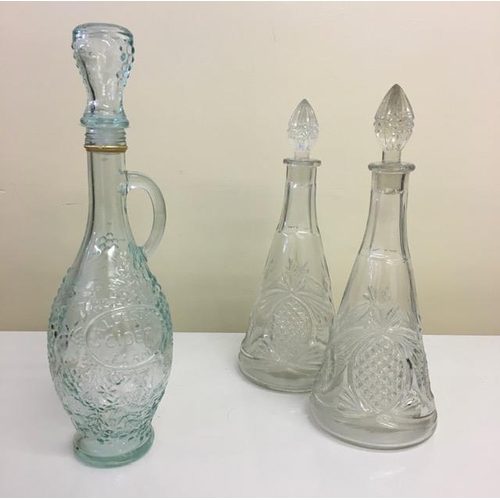 209 - A selection of three, vintage cut-glass Decanters. Two clear glass, together with a blue glass (Coll... 