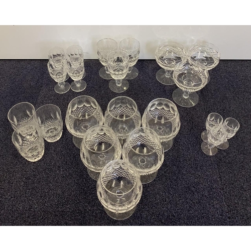 226 - A selection of 22 matching items of crystal glassware. Includes sherry glasses, brandy glasses etc.