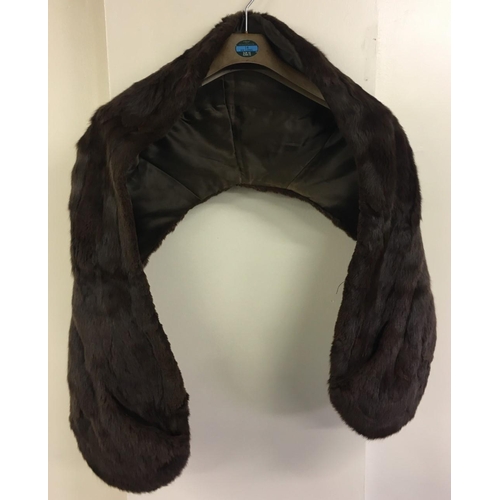 264 - A vintage, fake fur Shawl. Brown in colour. Lined, with two pockets. Size estimated as Small/Medium.
