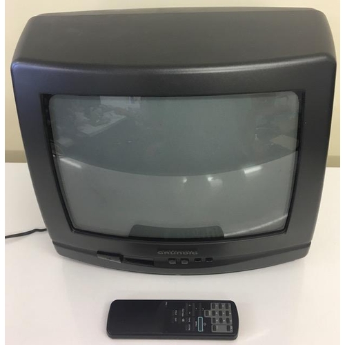 518 - A Grundig GT1401 portable CRT TV. Complete with remote control. Tested and appears in full working o... 