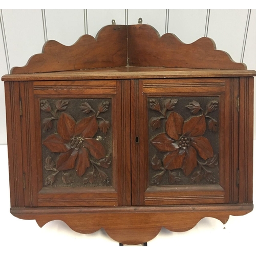 85 - A charming, antique wall-hanging Corner Cupboard.
Two carved doors. no key present.
Dimensions(cm) H... 