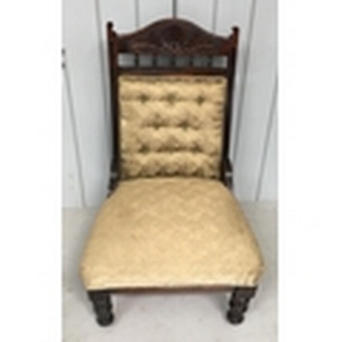 142 - A low armless lounge Chair.
Gold fabric covered, with a carved frame.
Dimensions(cm) H93 W57 D60