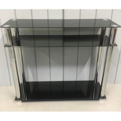 199 - A modern console table, with black-glass shelves, supported by chrome coloured legs.
Dimensions(cm) ... 