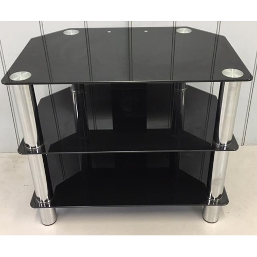 201 - A black, glass TV stand with chrome legs and cable management.
Dimensions(cm) H52 W60 D40
