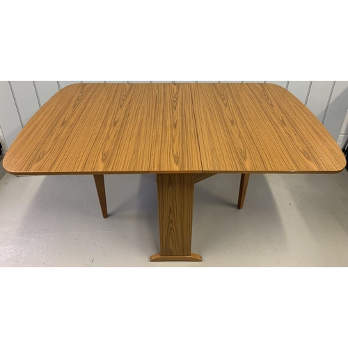 2 - A mid-century, teak-veneered. drop-leaf table, by Schreiber. Dimensions(cm) H75, W86, L25/147.