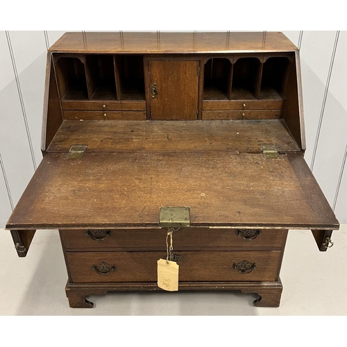 16 - A Georgian, oak bureau.
Fall-front. Fitted interior over four drawers. Original brass handles. Key p... 