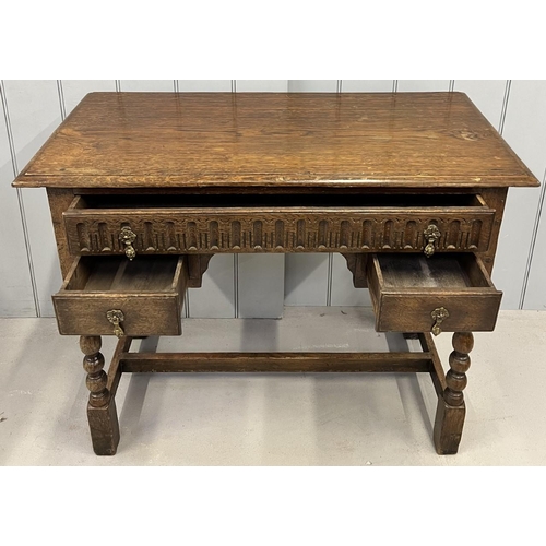 38 - A Jacobean-style, oak writing desk.
Three drawers, over stretchered barley-twist supports.
Dimension... 