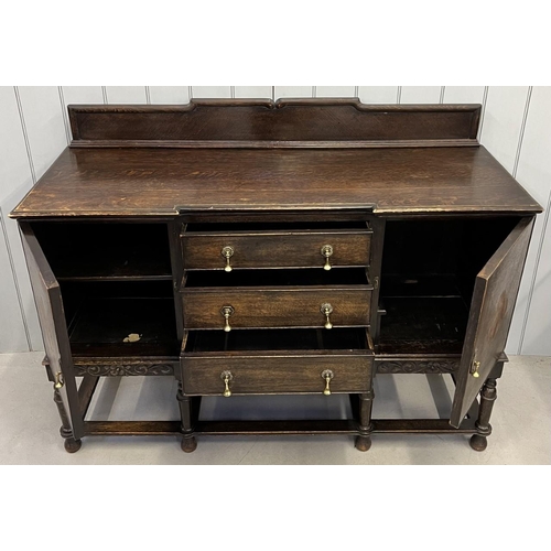 106 - An early 1900's Buffet Sideboard. Brass handles, stretchered base, three central drawers.
Dimensions... 