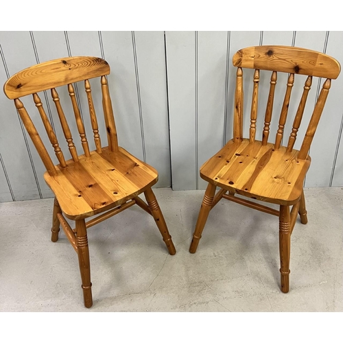 112 - A pair of pine, spindle-backed, kitchen chairs.
Dimensions(cm) H86(45 to seat), W40, D40.