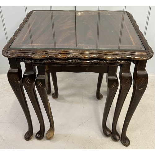 136 - A mahogany , glass-topped, nest of tables.
Largest dimensions(cm) H55, W55, D41