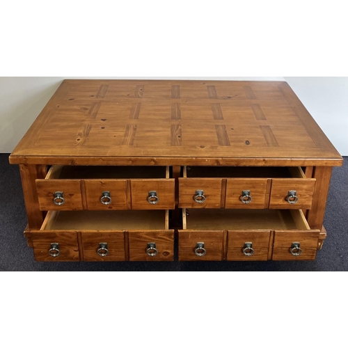 160 - A solid wood coffee table, with four drawers and chequered top. Dimensions(cm) H50, W126, D71.