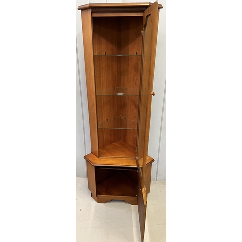A midcentury corner display by Rossmore Furniture. Dimensions