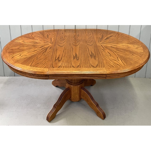 11 - A solid wood, extending dining table. Pedestal base, with extension leaf.
Dimensions(cm) H77, W107/1... 