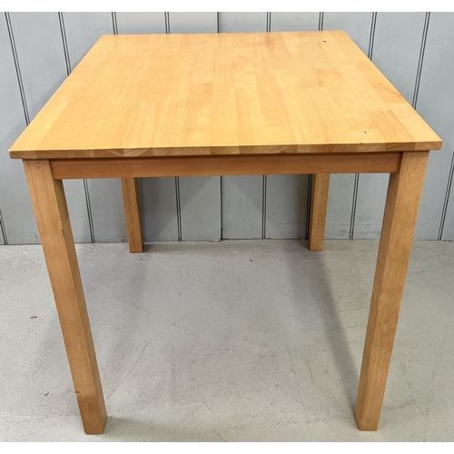 15 - A contemporary, beech coloured dining/kitchen table.
Dimensions(cm) H75, W69, D69.