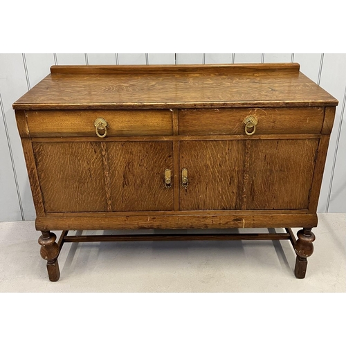 48 - An Edwardian, oak Buffet Sideboard. Two drawers, over single-shelved double cupboard, upon stretcher... 