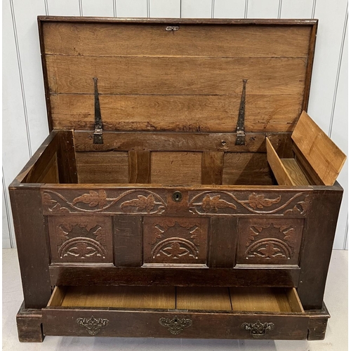 126 - An impressive, 18th century, carved oak coffer. Hinged lid with internal drawer/support, with one ex... 