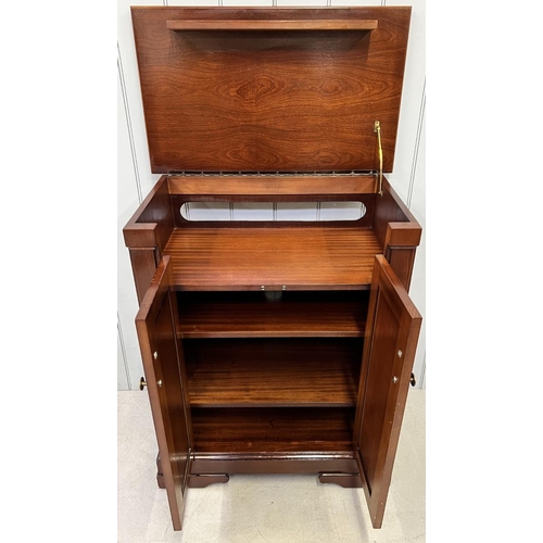 130 - A vintage, mahogany Hi-Fi cabinet. Hinged lid, with space for record deck, over three-drawered cupbo... 