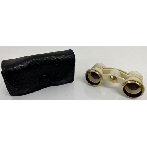 320 - A pair of Ivorine opera glasses with case.