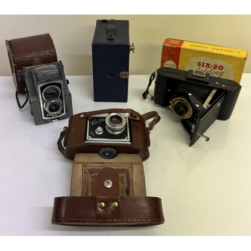 313A - A mixed lot of four vintage cameras. Includes Finetta Finetar, with case; Kodak Six-20 with original... 