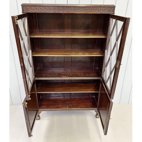 50 - An Edwardian, mahogany glazed cupboard bookcase. Glazed shelved cupboard, above two door cupboard, s... 