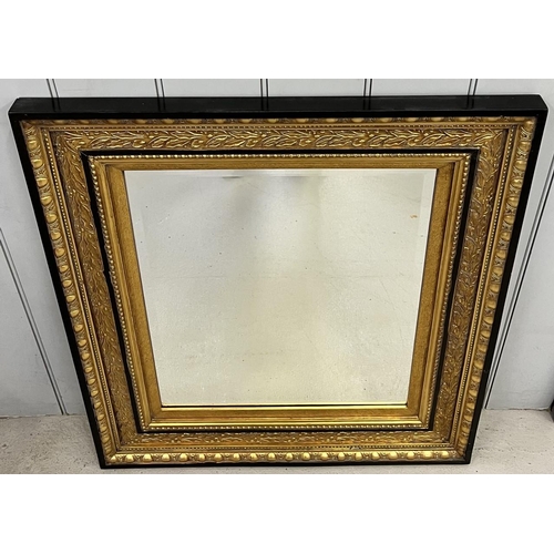 240 - A black & gold coloured, bevelled-edged mirror.
87cm x 77cm