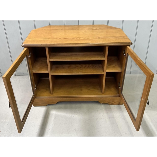 168A - A solid wood corner TV stand. Dimensions(cm) H63, W64, D45.