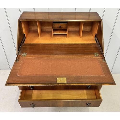 124 - A vintage bureau, with fall front & three drawers, supported by Queen Anne style legs.