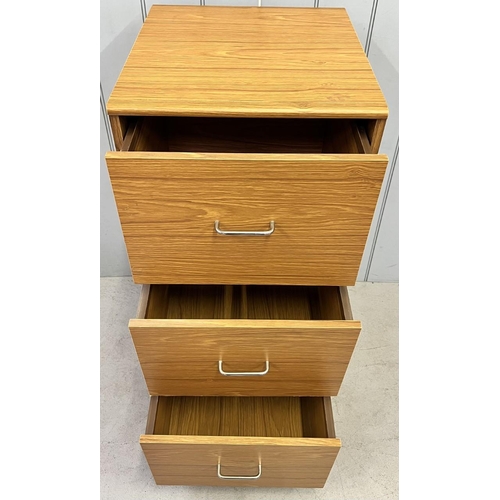 129 - A contemporary three-drawer filing cabinet. Dimensions(cm) H103, W47, D53.