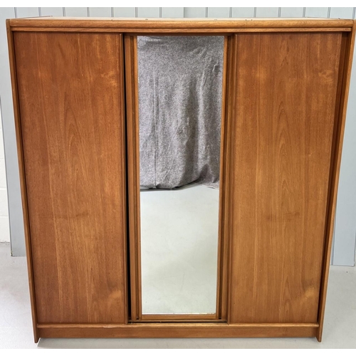 144 - A mid-century, teak, triple wardrobe, by Austinsuite.
Three sliding doors (one mirrored). Two single... 