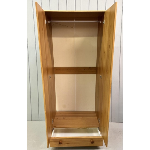 60 - A pine coloured double wardrobe. Single floor level drawer and a hanging rail.
Dimensions(cm): H191 ... 