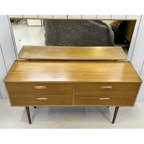 123 - A mid-century dressing table. Four drawers, with full length mirror. Dimensions(cm) H112, W126, D41.