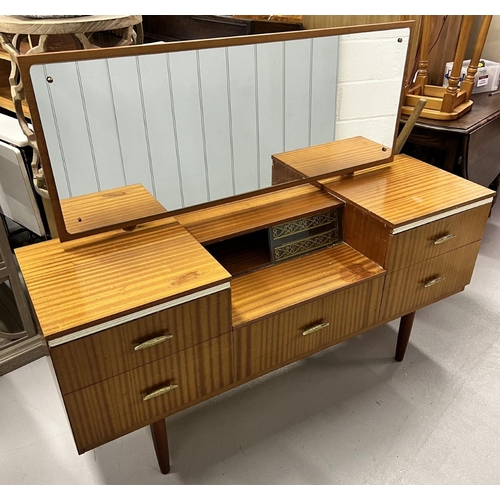 124 - A mid-century teak dressing table,
Dimensions(cm) H119, W144, D43.