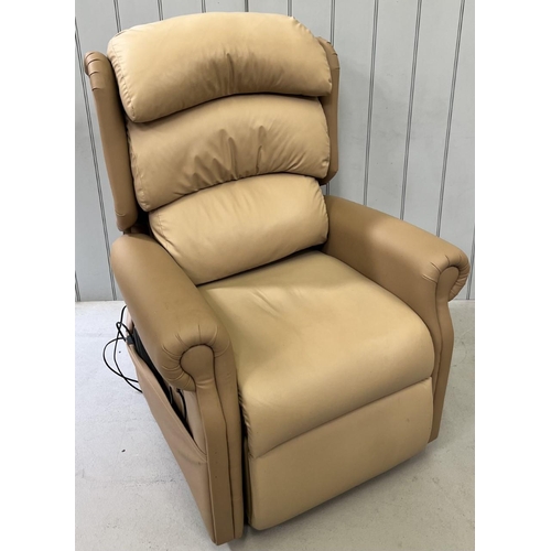 140 - A beige, vinyl, electric rise & recline armchair. Dimensions(cm) H125(48 to seat), W84, D85. Tested ... 