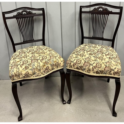 157 - A pair of slat-backed, carved head, dining chairs, together with a matching carver (requires restora... 