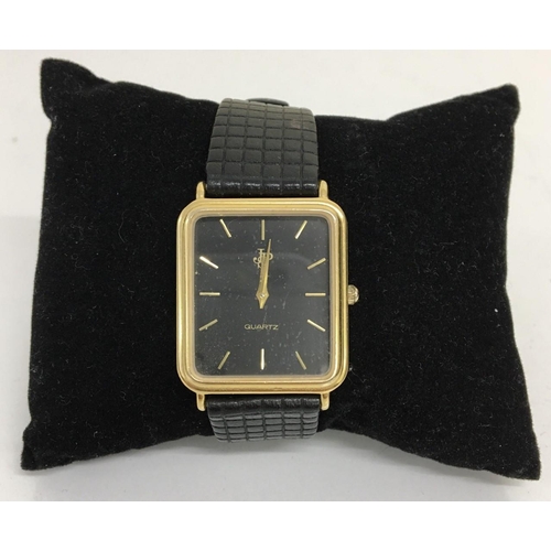 391 - A vintage 'John Player Special' black, quartz, gents watch, with leather strap.