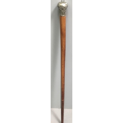 420 - A silver-topped cane. No visible hallmark.