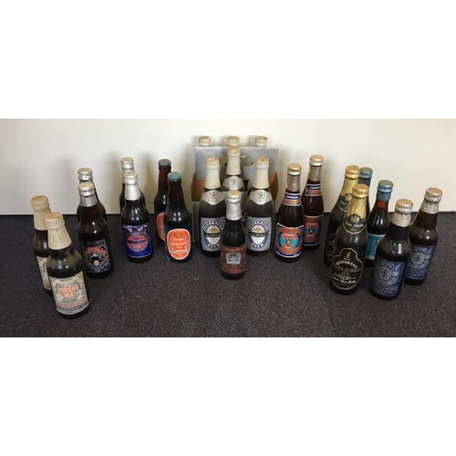 486 - A collection of vintage, souvenir/collectable unopened beers. Twenty-three in total. Includes Charle... 