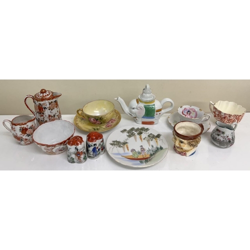 593 - A large collection of 14 oriental ceramic items. Includes hand painted teacups & saucers, Toby Jug p... 