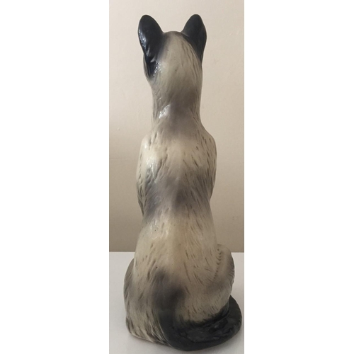 621 - A large scale ceramic black & white cat, with blue eyes.
43cm tall.