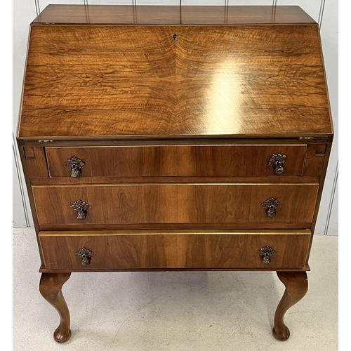 111B - A vintage bureau, with fall front & three drawers, supported by Queen Anne style legs.