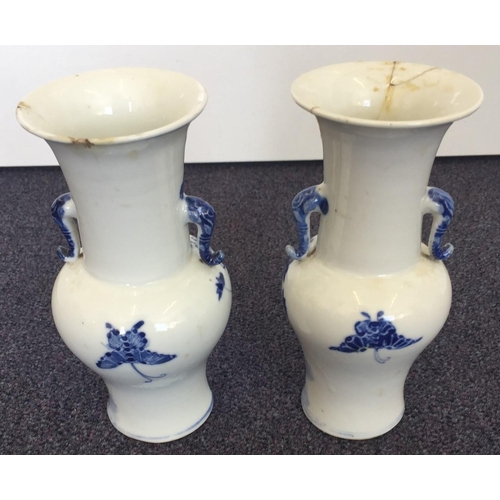 502 - A pair of Chinese vases. Both have signs of repair. Height 15cm.