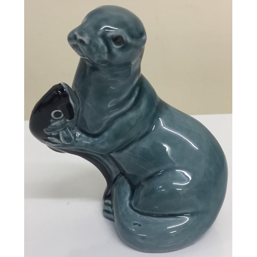 624X - A 'Poole Pottery' Otter figure. 12cm tall.