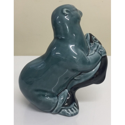 624X - A 'Poole Pottery' Otter figure. 12cm tall.