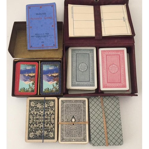 2491 - A selection of vintage playing cards. Includes a set of patience cards with booklet.