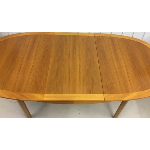 14 - A mid-century teak, extending dining table by 'Nathan'. Dimensions(cm) H76, W152/205, D99.