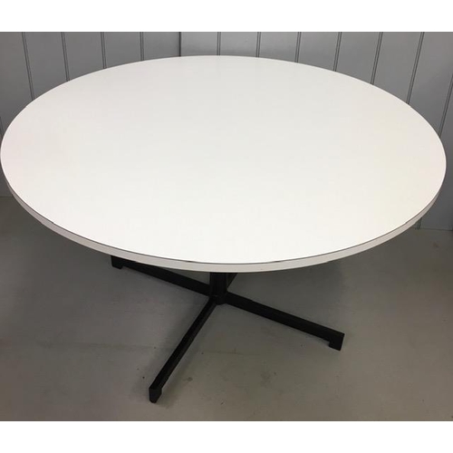 15 - A retro, white, circular dining table, together with six (stacking), aqua-coloured, moulded dining c... 