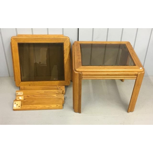 28 - A pair of stylish coffee tables, with smoked glass tops. One has bolt fixings missing. Dimensions(cm... 