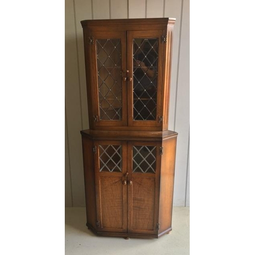 41 - An oak corner cabinet, with leaded glazed doors.
Dimensions(cm) H178, W80, D45.