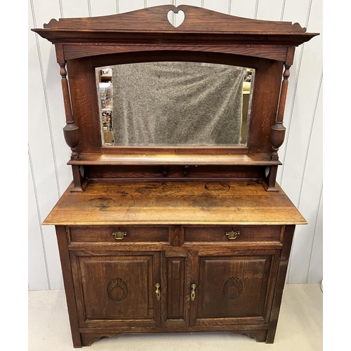 42 - A brass handled, oak dresser with carved detailed doors and bevelled-edged mirror.
Dimensions(cm): H... 